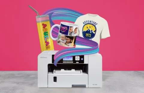 Photo of sublimation printer with examples of things that can be made with it. Personalized t-shirt, tumbler and mug are shown. 