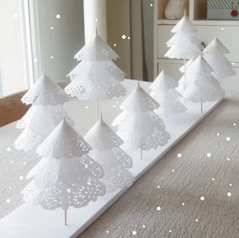 White pine trees made out of doilies and sticks